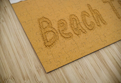 Beach Time written in sand with sea surf Steve Heap puzzle