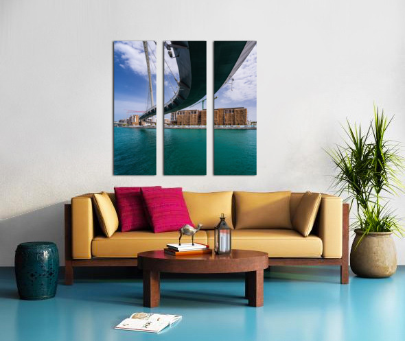 Modern apartments alongside Dubai Canal under Tolerance bridge Split Canvas print