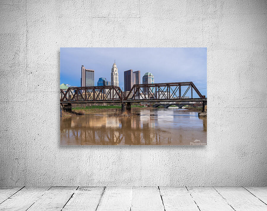 Columbus Ohio waterfront skyline behind railroad truss bridge Wall Preview