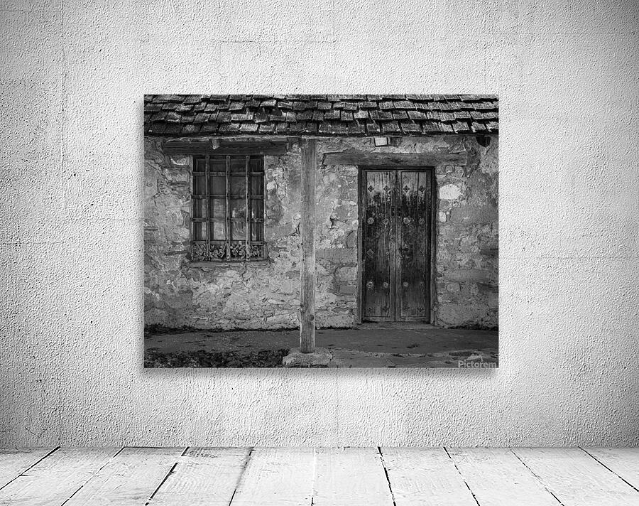 Rustic San Juan Mission building with an aged stone facade. Wall Preview