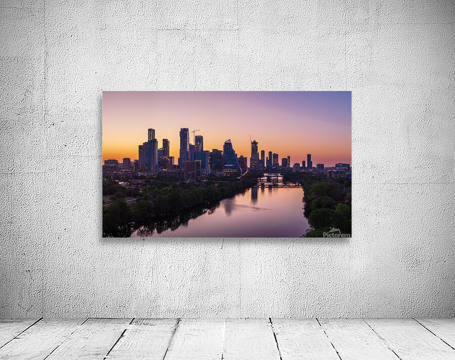 Orange skies behind skyline of Austin Texas as sun starts to ris Wall Preview