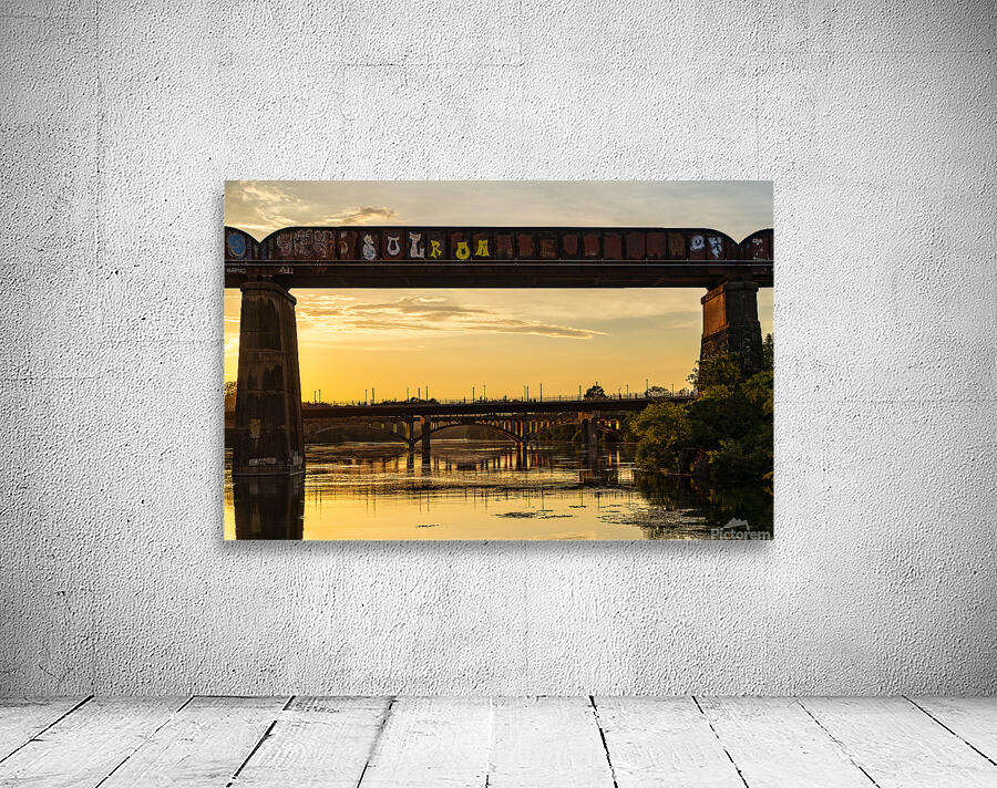 Bridges behind the railroad bridge in Austin at sunset Wall Preview