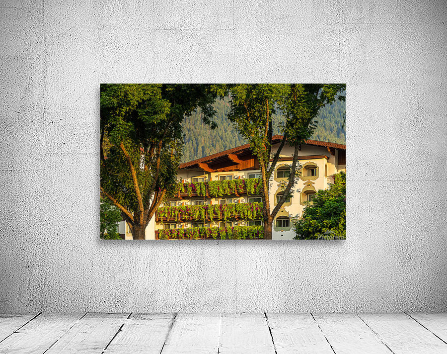 Flower strewn balconies of a hotel in Alpine village of Leavenwo Wall Preview