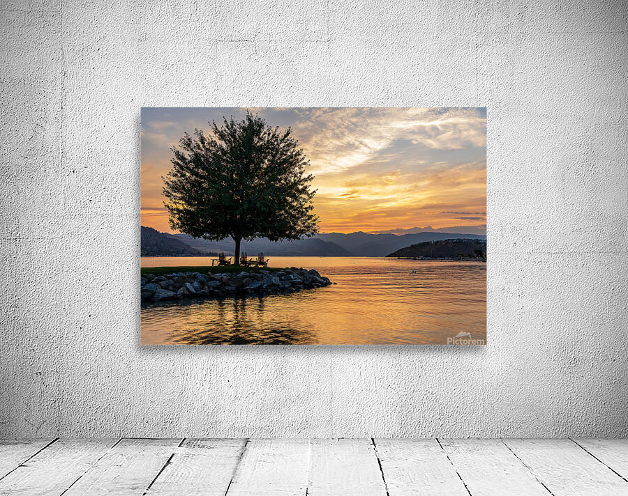 Sunset over Lake Chelan with silhouette of tree and chairs for r Wall Preview