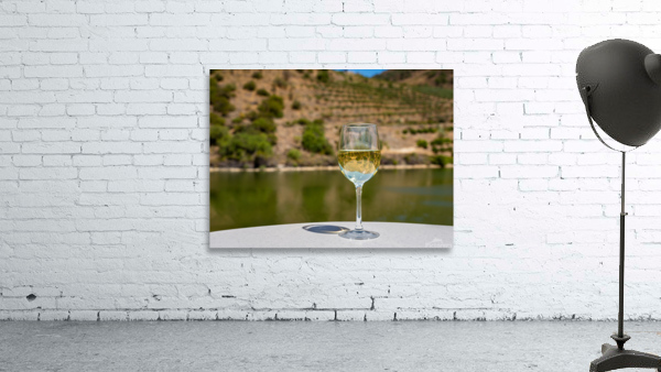 Glass of white wine by Douro river in Portugal by Steve Heap