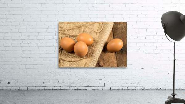 Freshly laid organic eggs on wooden bench by Steve Heap