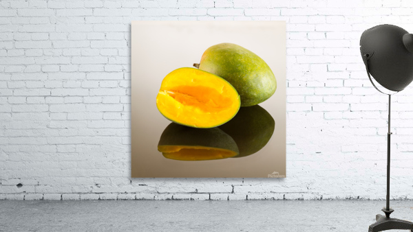 Two mangoes on reflecting surface by Steve Heap