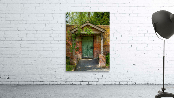 Painted green door and porch in walled garden wall by Steve Heap