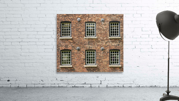 Restored industrial cotton mill with pattern of windows by Steve Heap