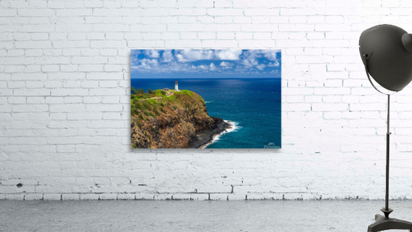 Kilauea lighthouse on headland against blue sky on Kauai Wall Preview