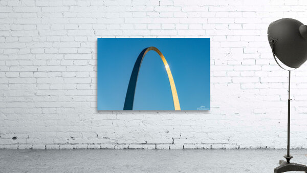 Unusual view of Gateway Arch at sunrise against blue sky by Steve Heap