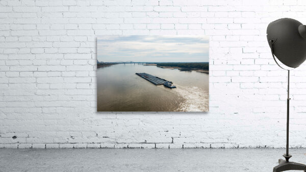 Large barge boat sails under Memphis bridge in October 2023 by Steve Heap