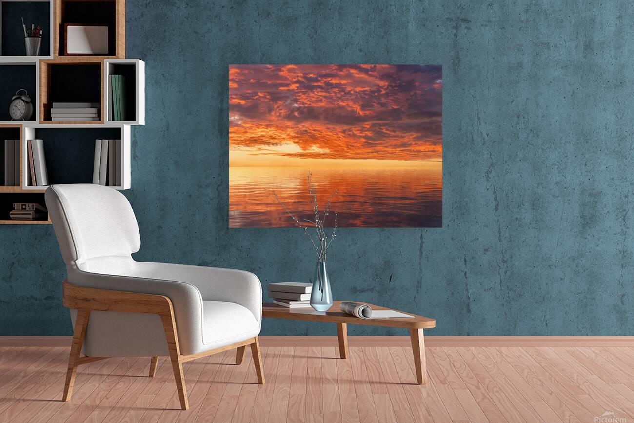 Dramatic sunset reflected in the smooth ripples of a lake or oce Reproduction