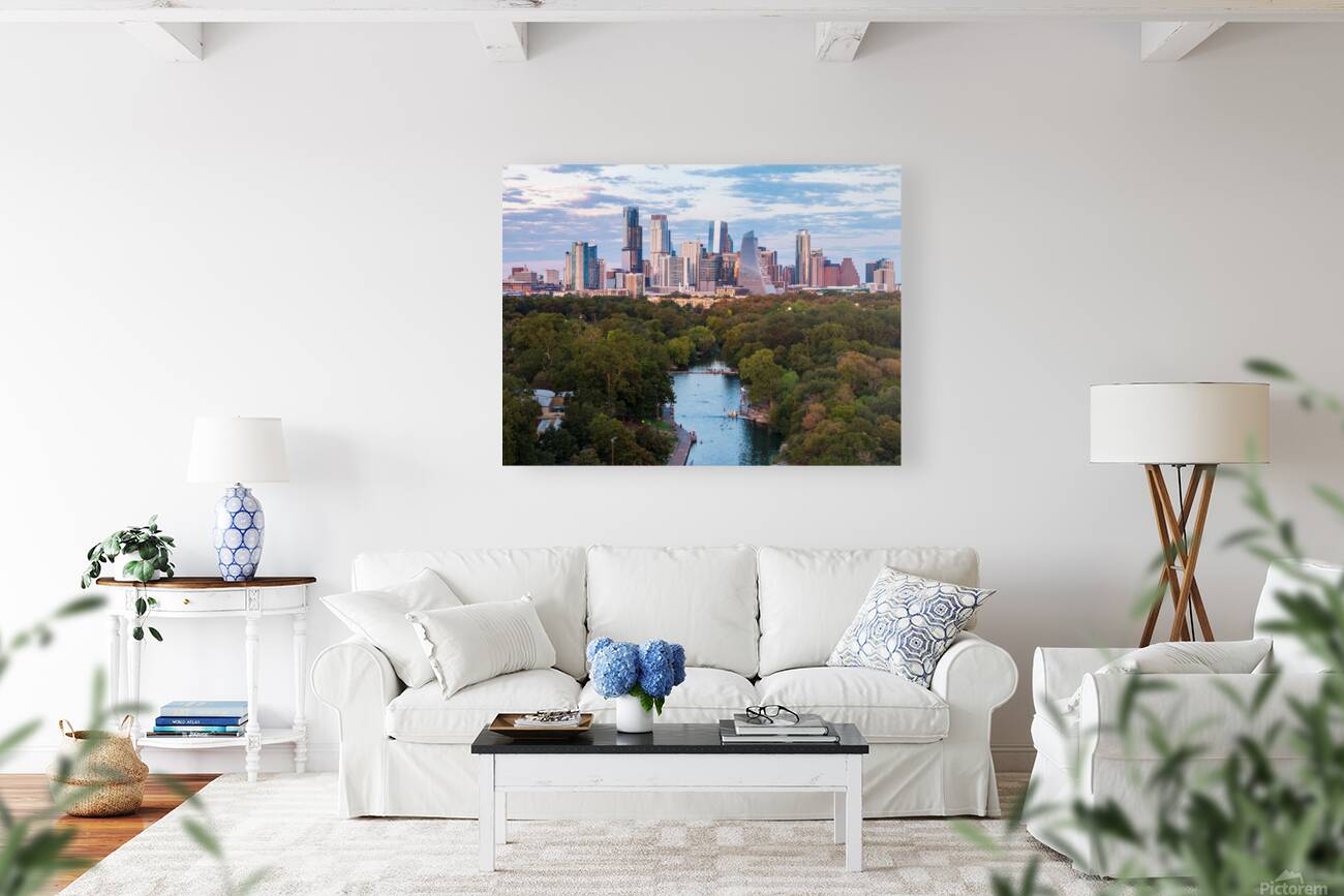 Aerial view of the Austin skyline at sunset over Barton Springs. Reproduction