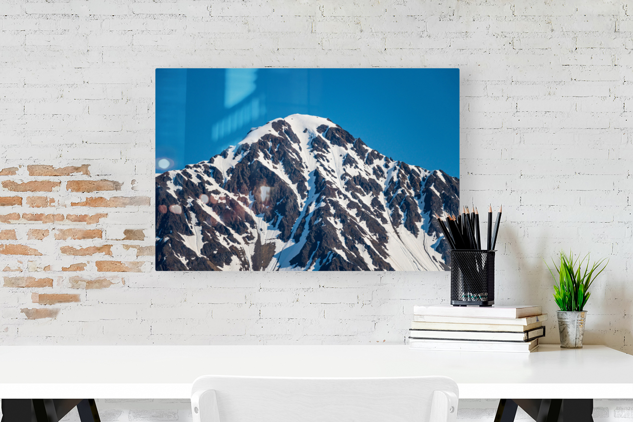 Peak of mountain overlooking Seward in Alaska Reproduction