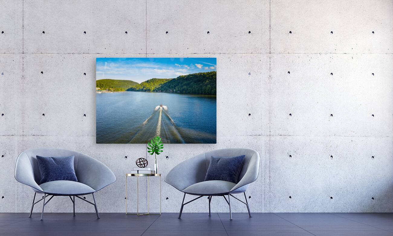 Speedboat on Cheat Lake on a summer evening with boats docked in Reproduction