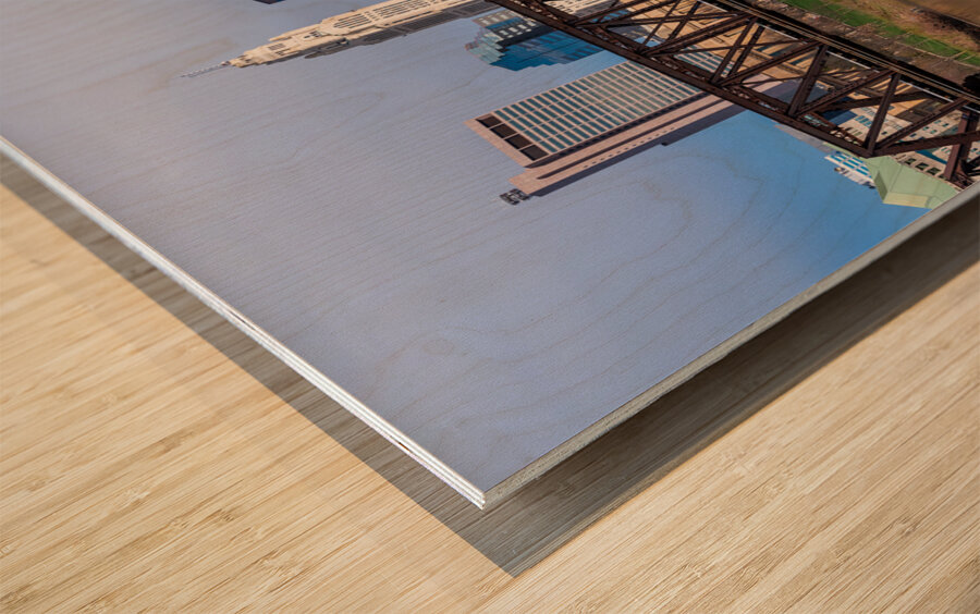 Columbus Ohio waterfront skyline behind railroad truss bridge Wood print