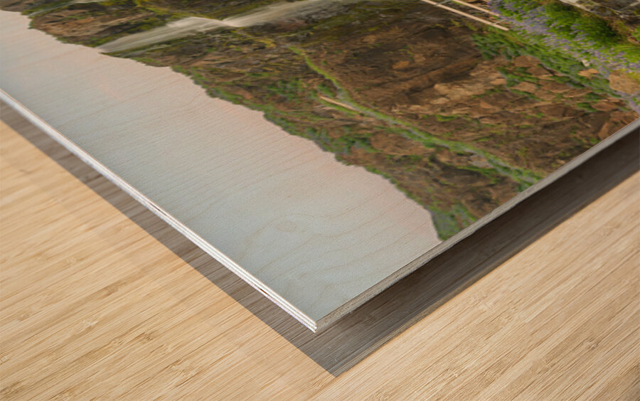 Budareyrarfoss waterfall cascades down the mountain by the port  Wood print