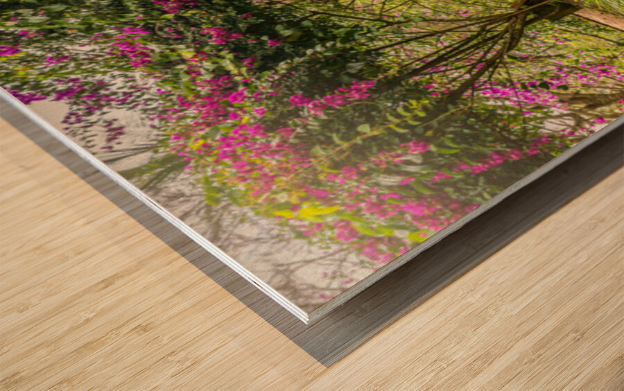 A vintage wooden rocking chair with a straw hat rests on a porch Wood print