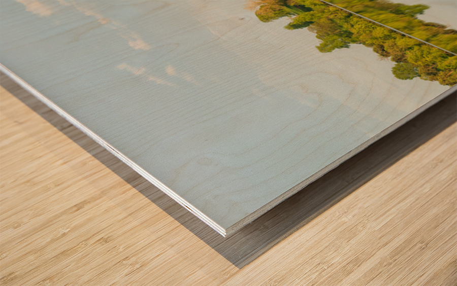 View across the Mere to a clear reflection of distant trees in E Wood print