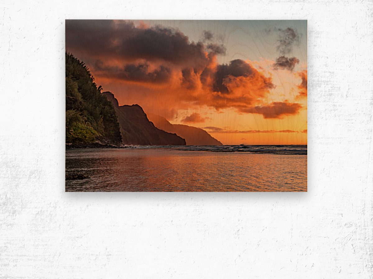 Sunset over the receding mountains of the Na Pali coast of Kauai in Hawaii Wood print