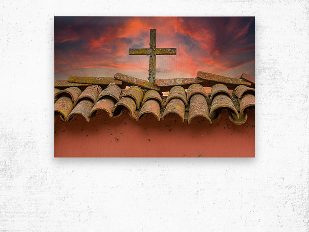 Wooden cross against brilliant sunrise at mission in California Wood print